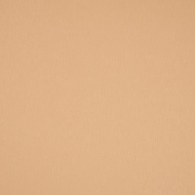 Plain muscade peach cotton fabric with a smooth, matte finish
