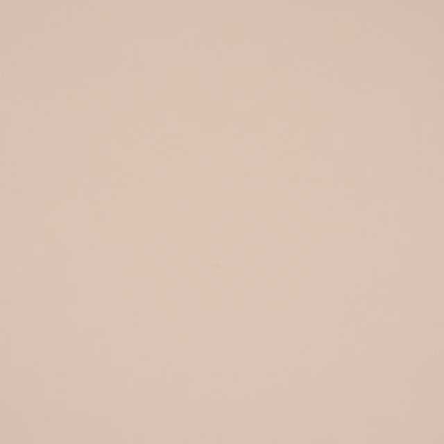 Pale pearly cream plain cotton fabric with a softly matte surface