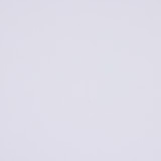 Soft chalk-white plain cotton swatch with a smooth matte finish