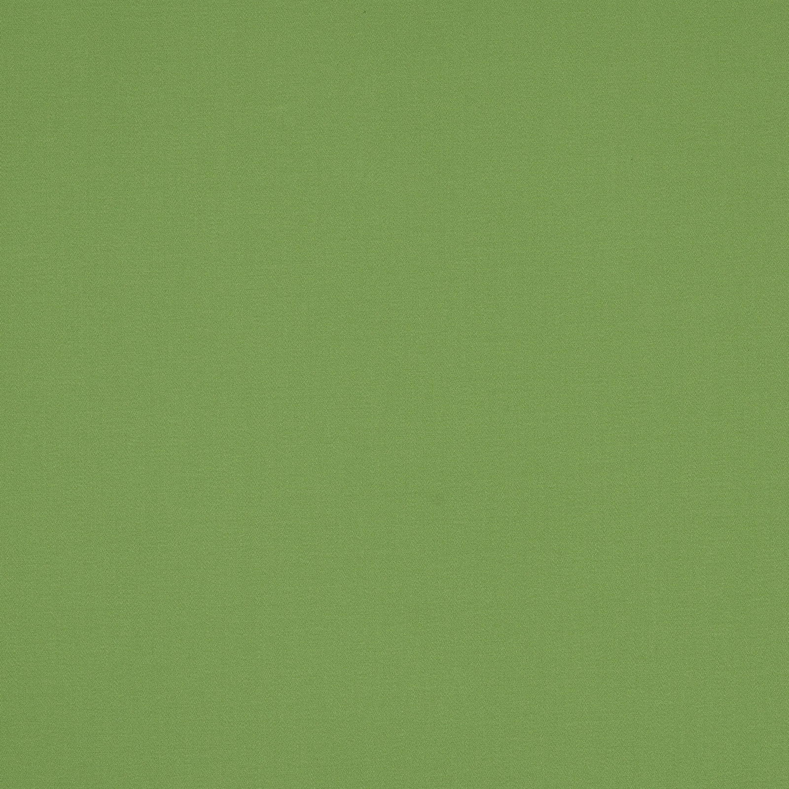 Plain pistache green cotton fabric swatch with a smooth matte weave