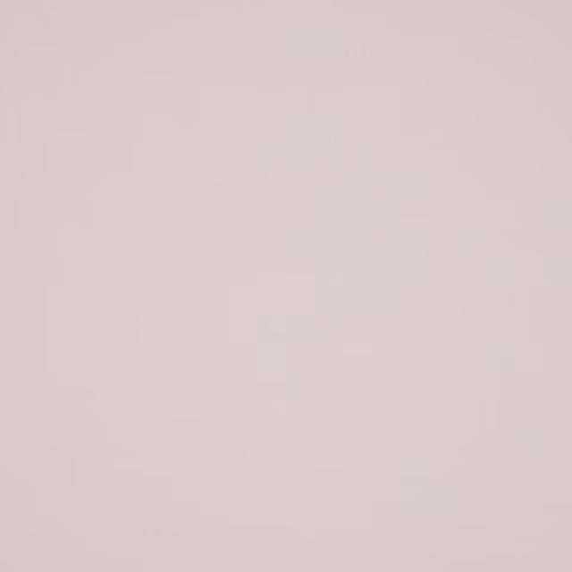Pale poudre pink plain cotton swatch with a smooth matte texture