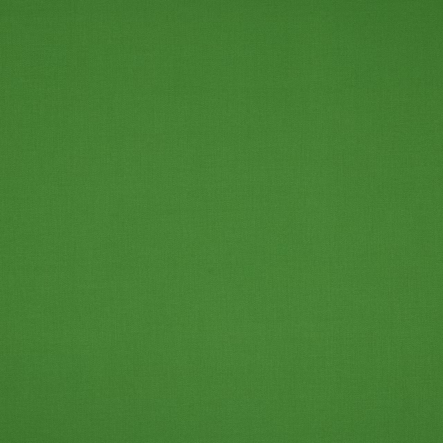 Fresh grass-green plain cotton fabric with a subtle woven texture
