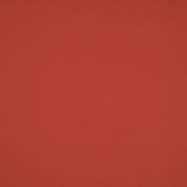 Plain warm terracotta cotton fabric with a smooth matte weave