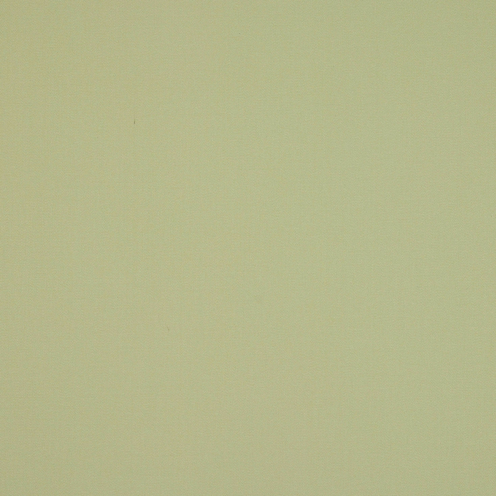 Plain soft tilleul green cotton fabric swatch with a smooth matte finish