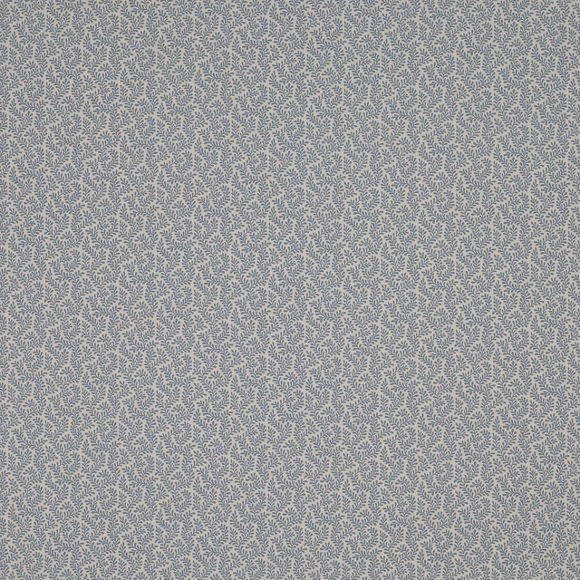 Close-up of a small leaf motif fabric in soft dusty blue on a pale ground