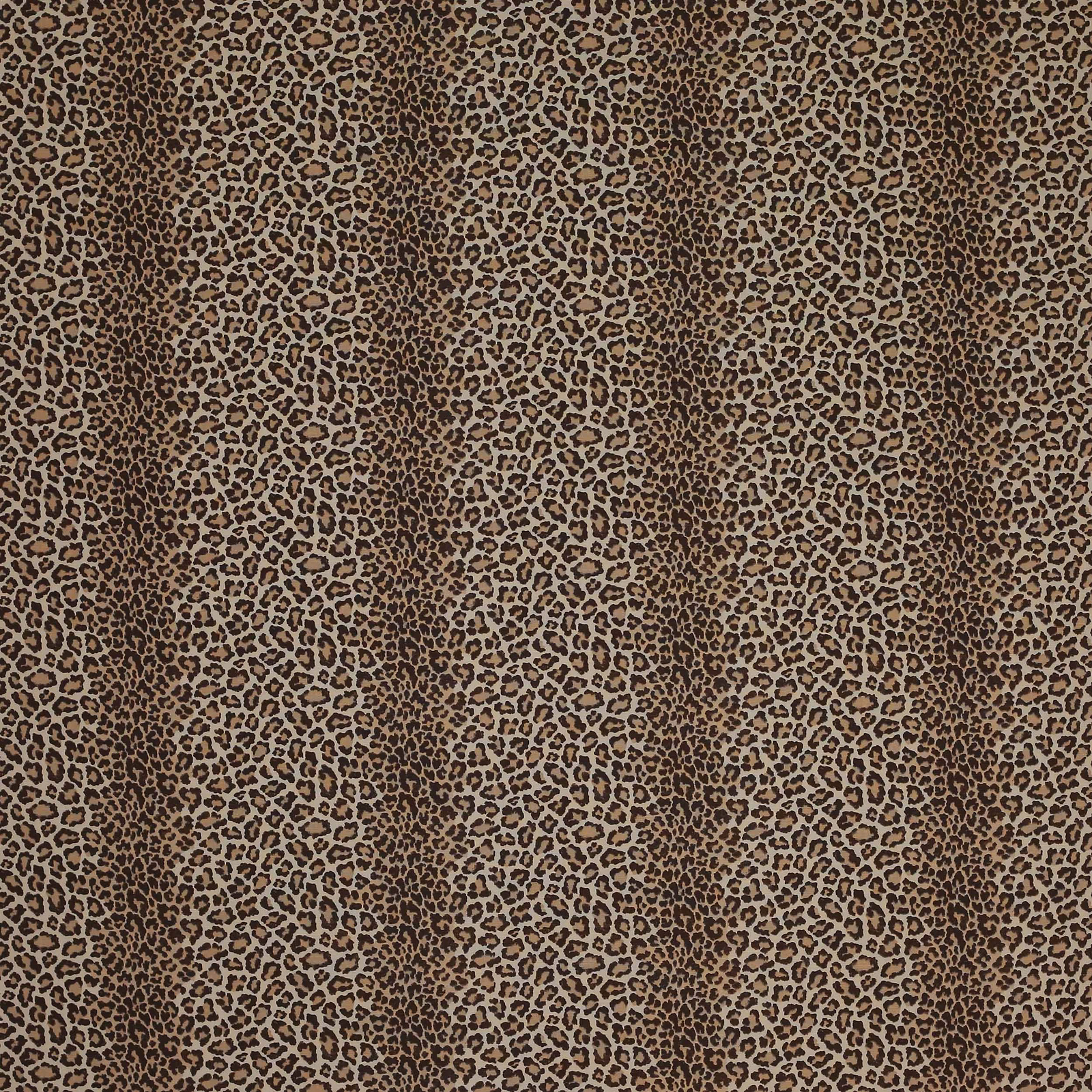 Close-up of small leopard spots in warm chocolate and tan on woven fabric