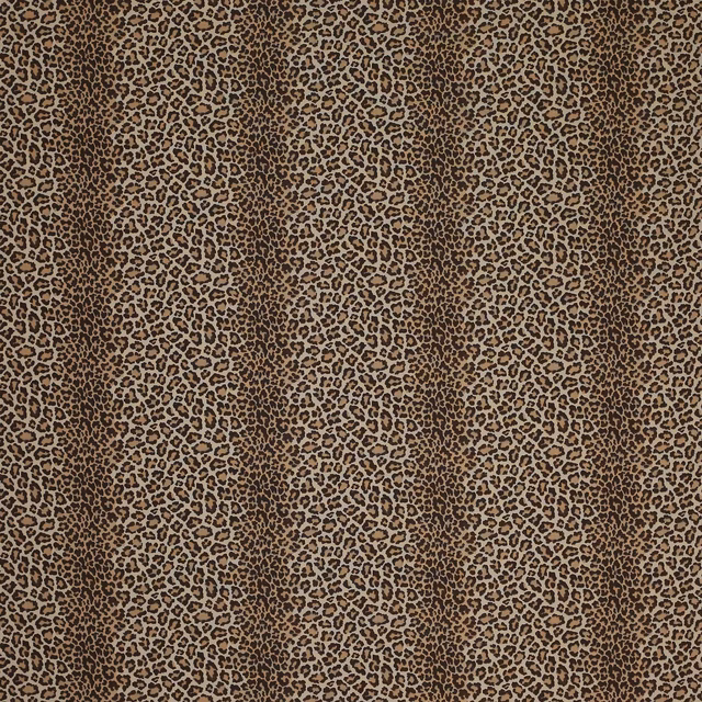 Close-up of small leopard spots in warm chocolate and tan on woven fabric