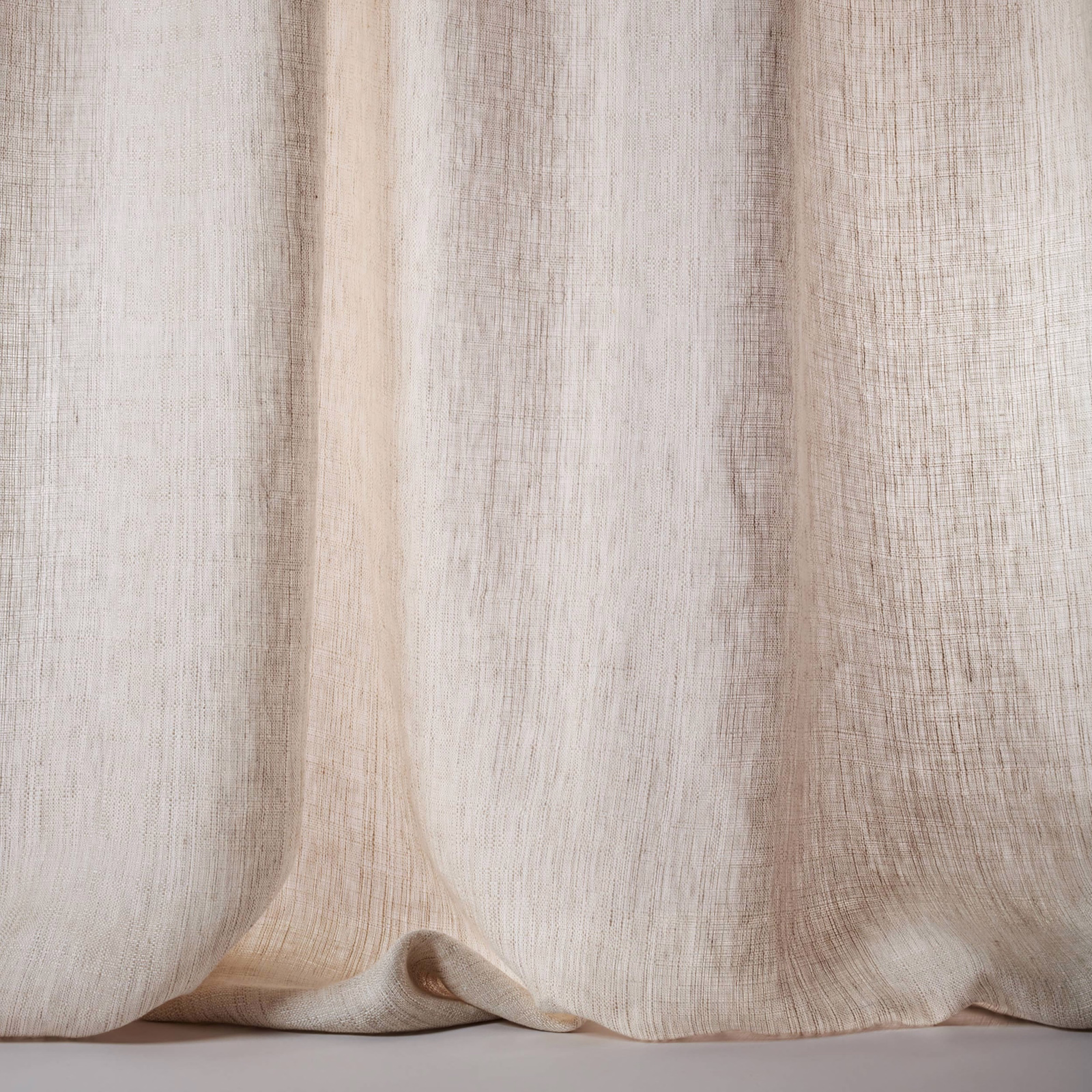 Soft warm beige linen sheer with subtle slubbed vertical texture and flowing folds