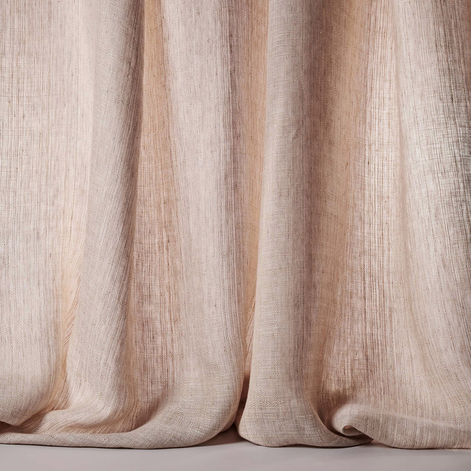 Pale stone-beige linen sheer with soft vertical striations and gentle folds