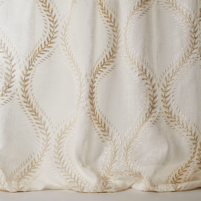Ivory sheer fabric with large gold leaf-lattice embroidery and soft linen texture