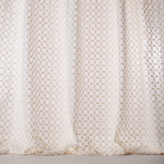Sheer ivory cotton fabric with tiny gold geometric lattice pattern