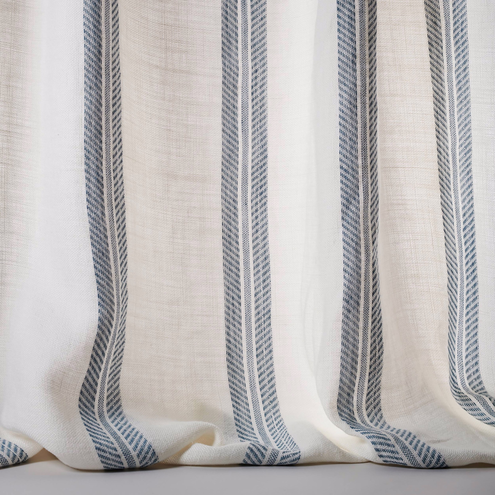 Ivory linen sheer with narrow blue-grey vertical stripes and soft drape