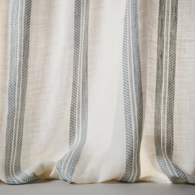 Sheer linen fabric with wide muted blue-grey vertical stripes and soft natural texture