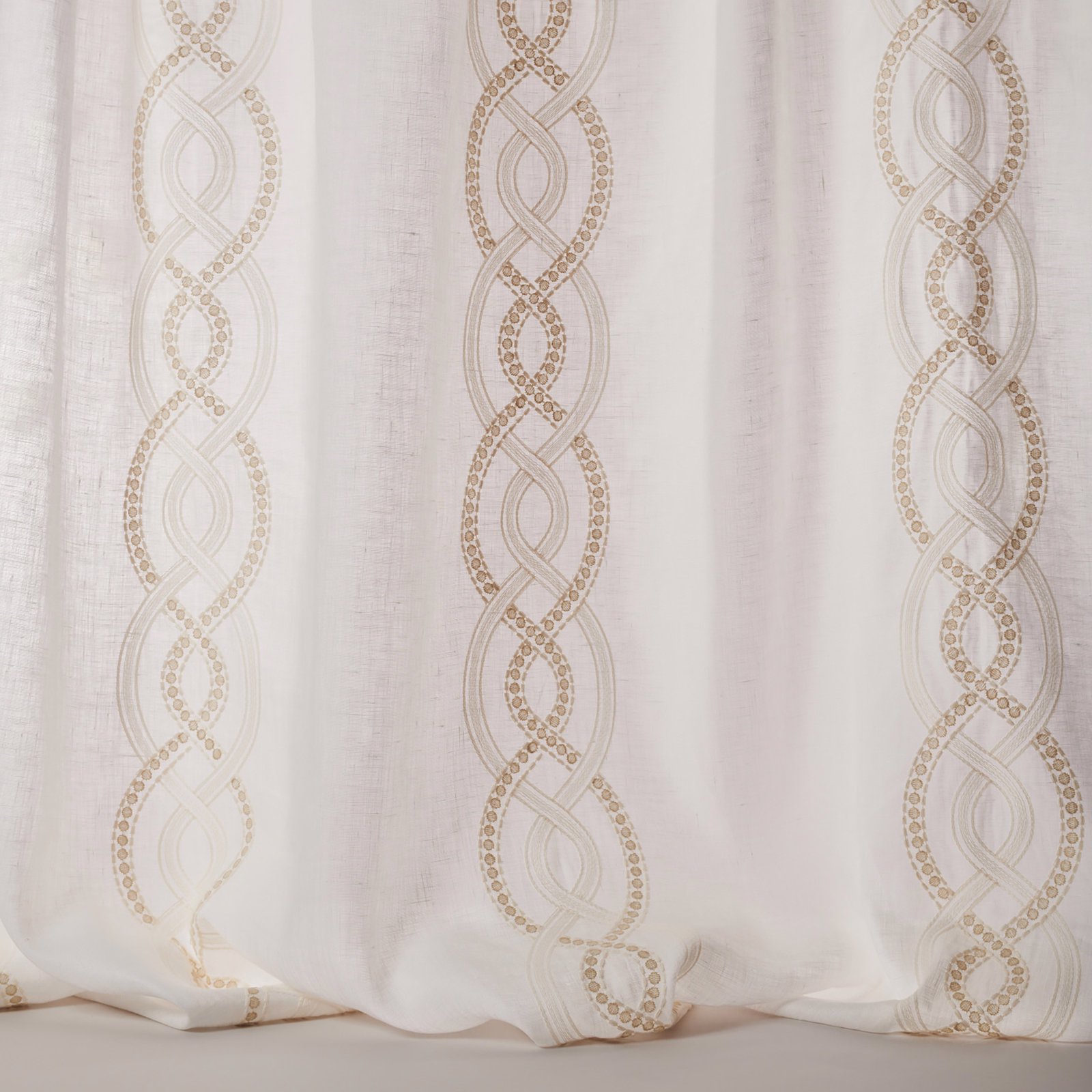 Sheer ivory fabric with linked vertical stripe and tiny gold-dot detailing