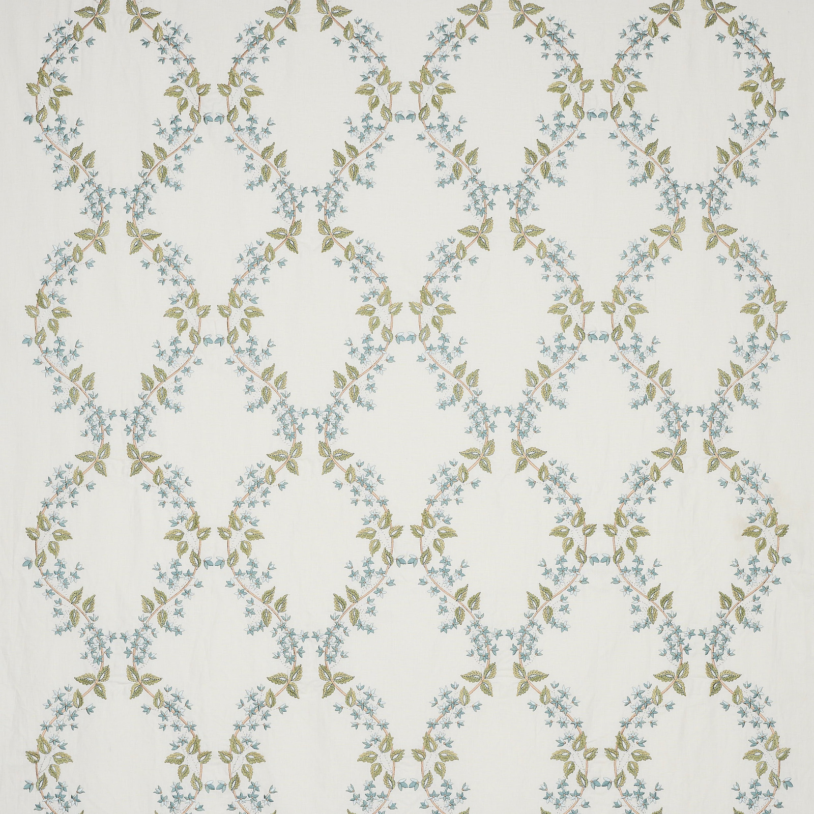 Pale floral trellis fabric with muted old blue and olive leaves on an ivory ground
