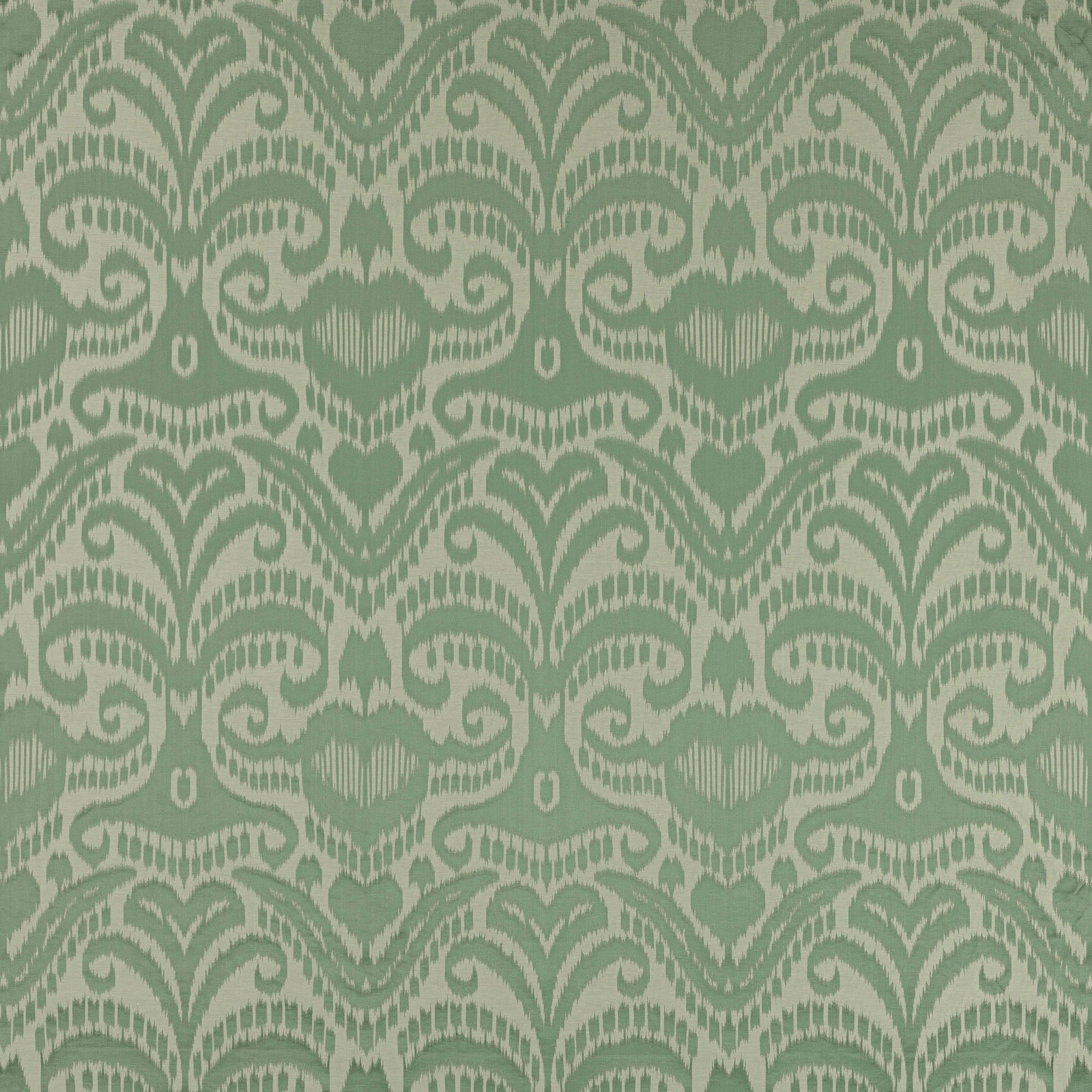 Celadon green damask fabric with scrolling motifs and a soft woven sheen