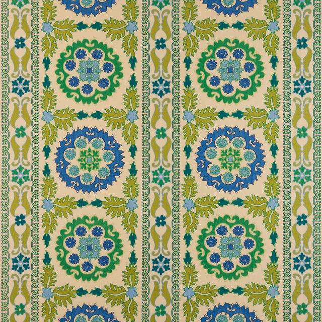 Patterned fabric swatch with kiwi green, blue and cream medallions in a stripe layout