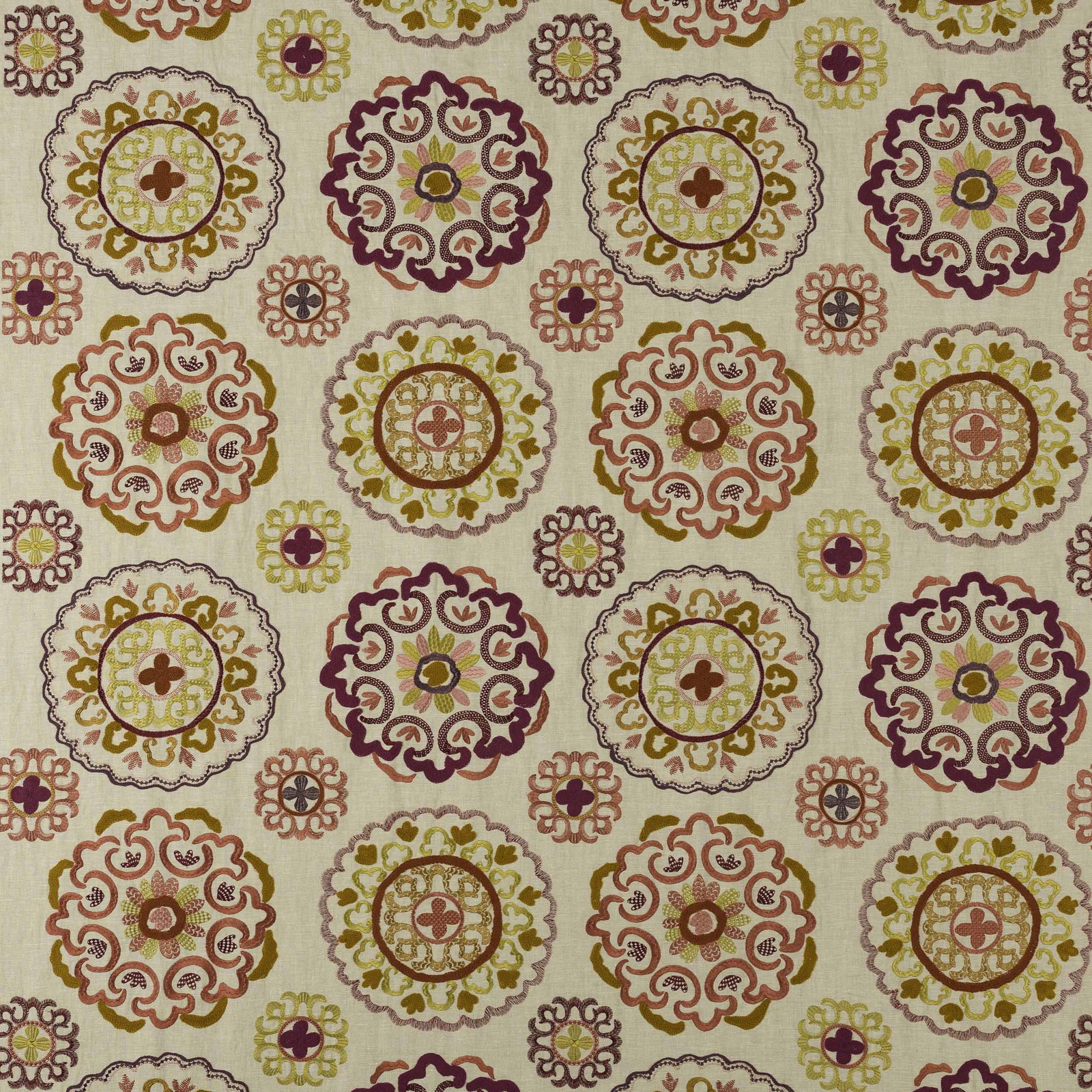 Ivory fabric swatch with circular pink, mustard and plum medallion motifs