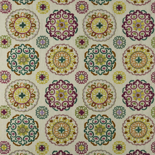 Cream fabric swatch with large fuchsia scalloped medallions and multicolour embroidered-look motifs