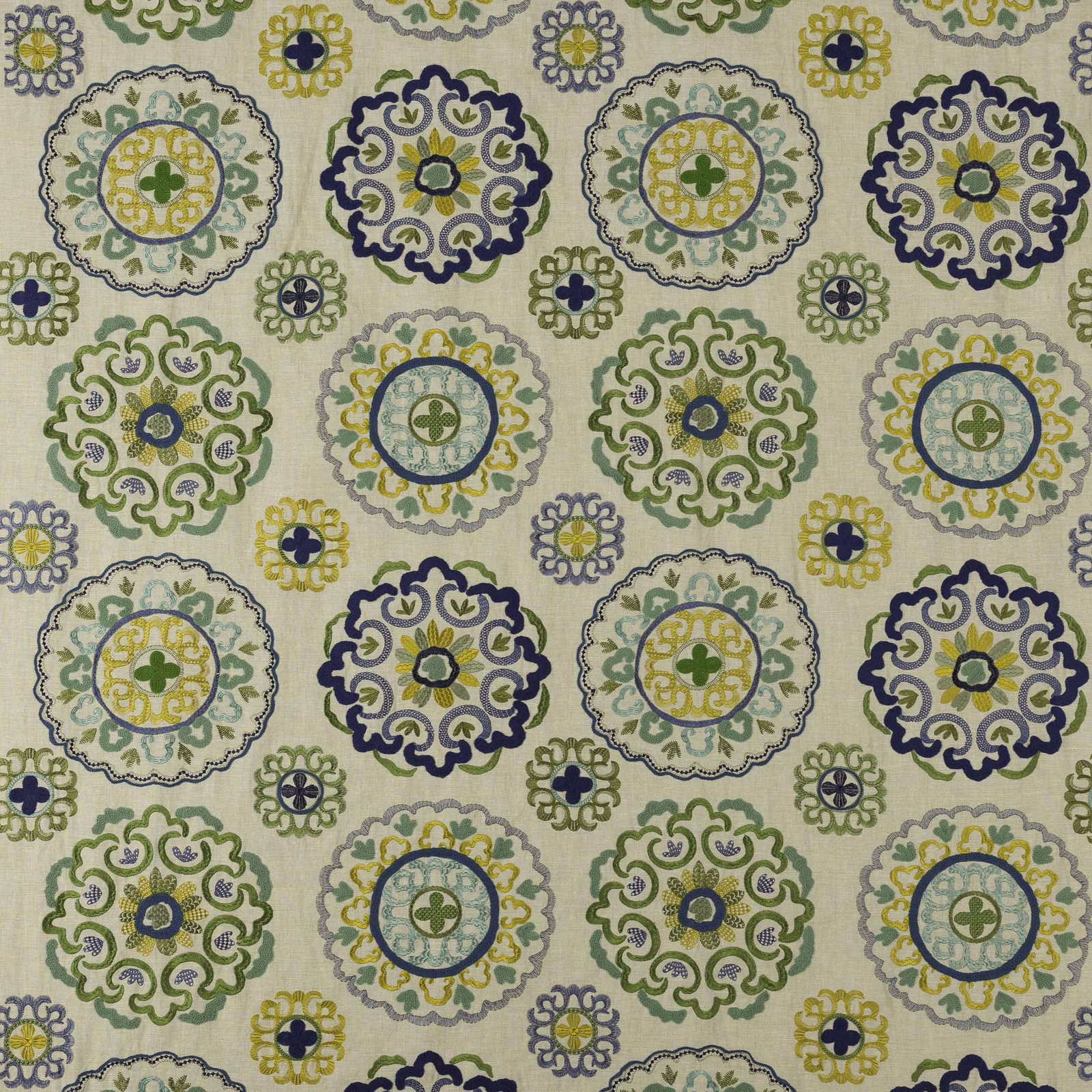 Ivory fabric swatch with repeating blue, green and yellow circular medallions