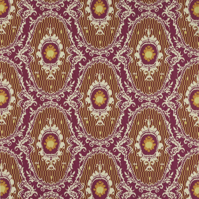 Close-up of Persane Fuchsia damask fabric with fuchsia scrolls, orange medallions and striped rust ground