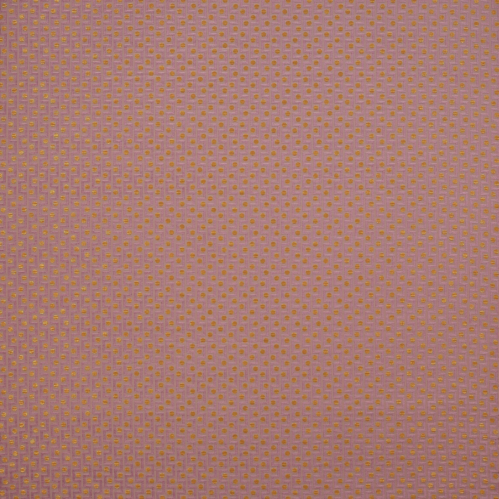 Close-up of lilac fabric with tiny gold repeating woven motif