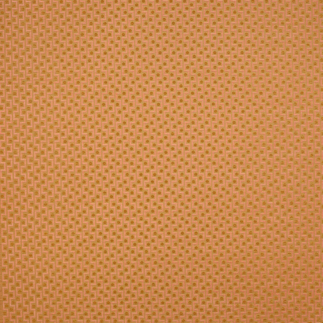 Soft dusty rose fabric with a tiny geometric dot-and-square weave pattern