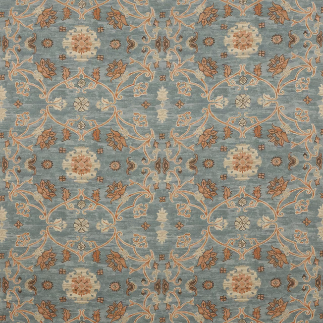 Blue damask fabric swatch with terracotta and cream floral scroll motifs
