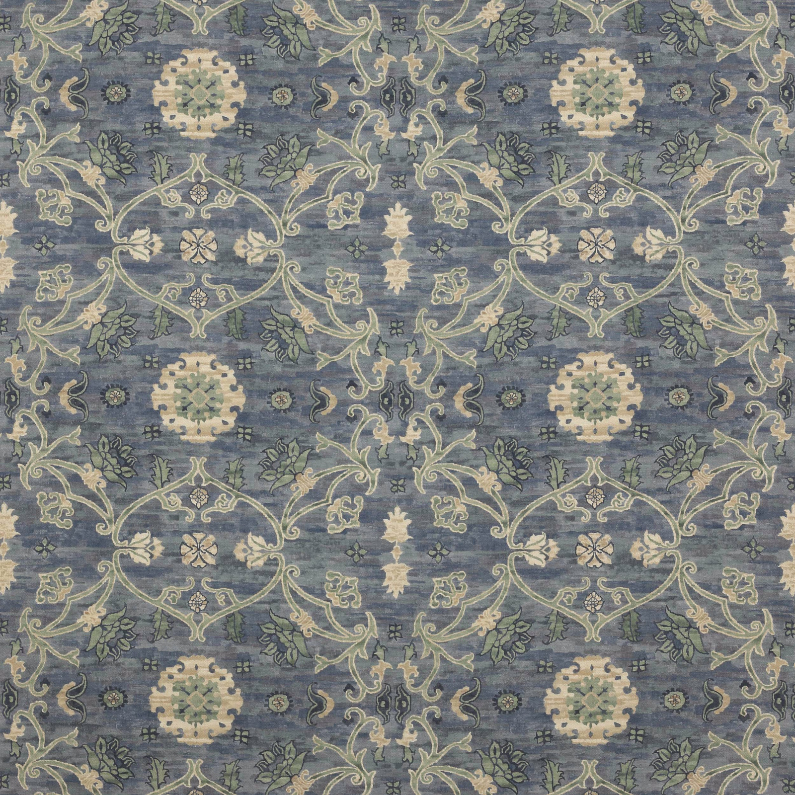 Blue-grey patterned fabric with cream scrollwork and medallion motifs
