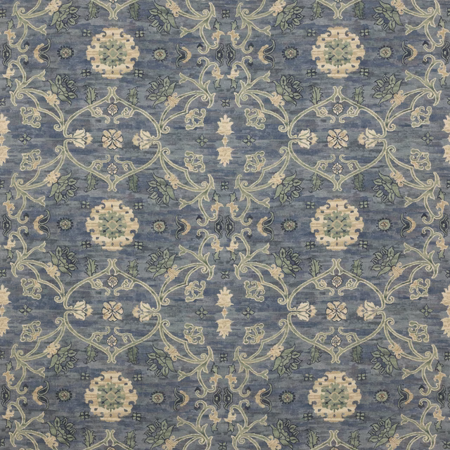 Blue-grey patterned fabric with cream scrollwork and medallion motifs