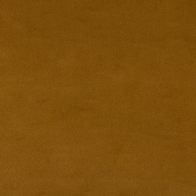 Plain muted ochre-gold cotton swatch with a soft matte weave