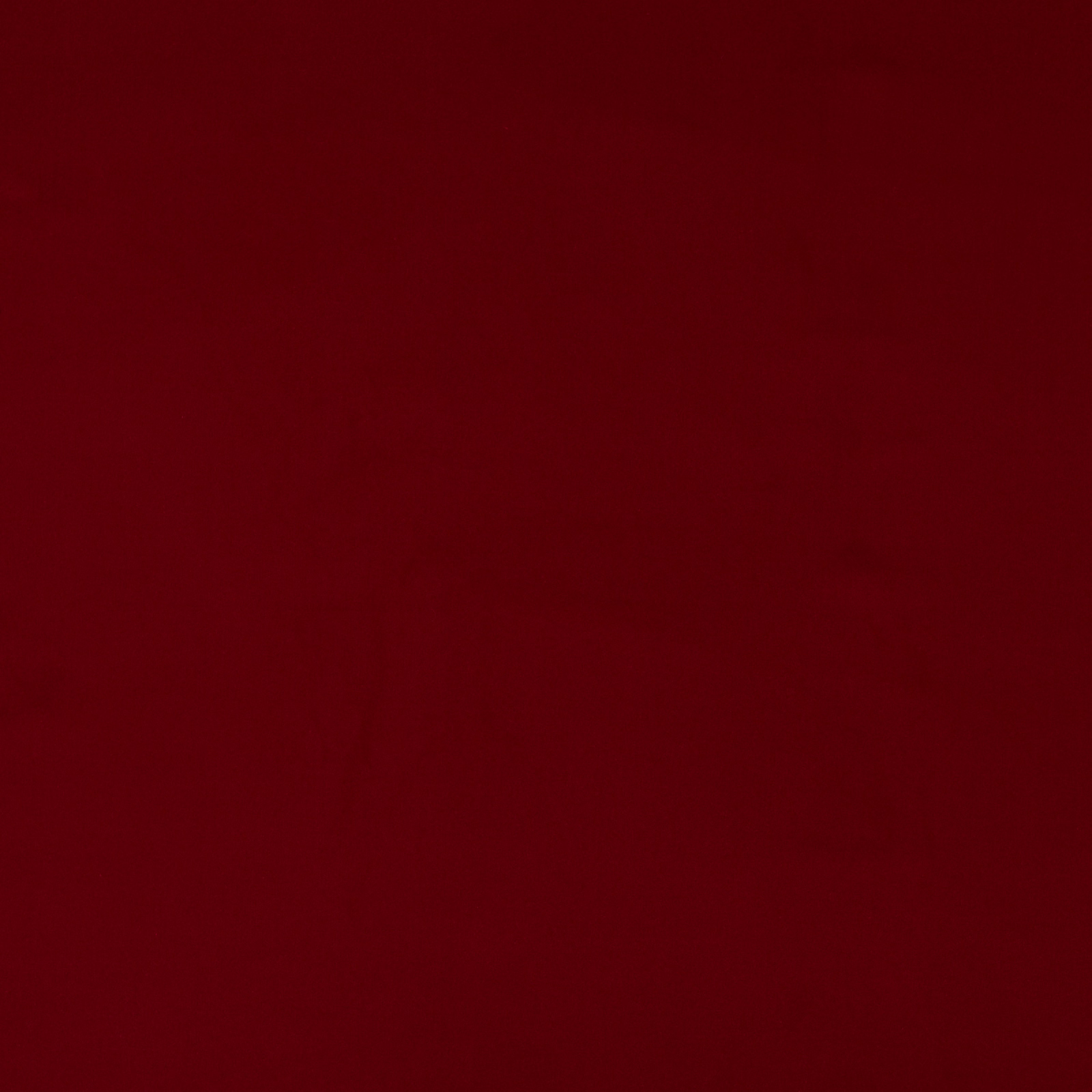 Deep oxblood red plain cotton fabric swatch with a soft matte texture