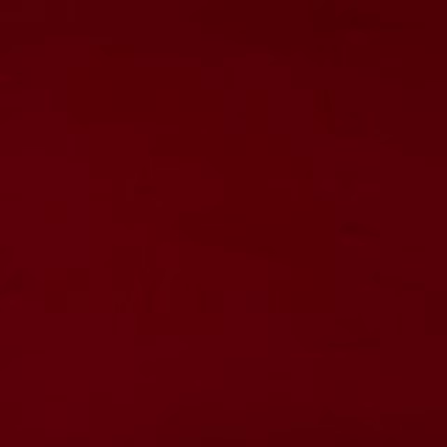 Deep oxblood red plain cotton fabric swatch with a soft matte texture