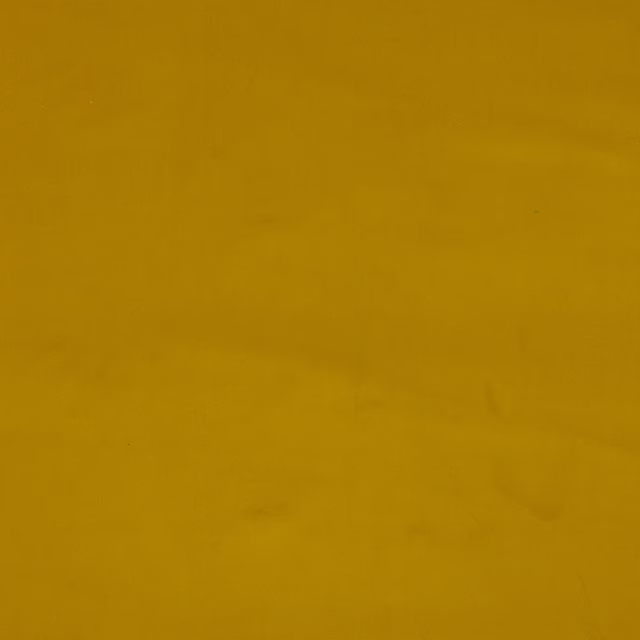 Solid mustard yellow cotton fabric swatch with a matte plain weave