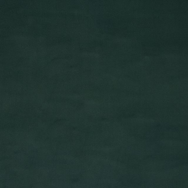 Deep forest green plain cotton fabric swatch with a soft matte surface