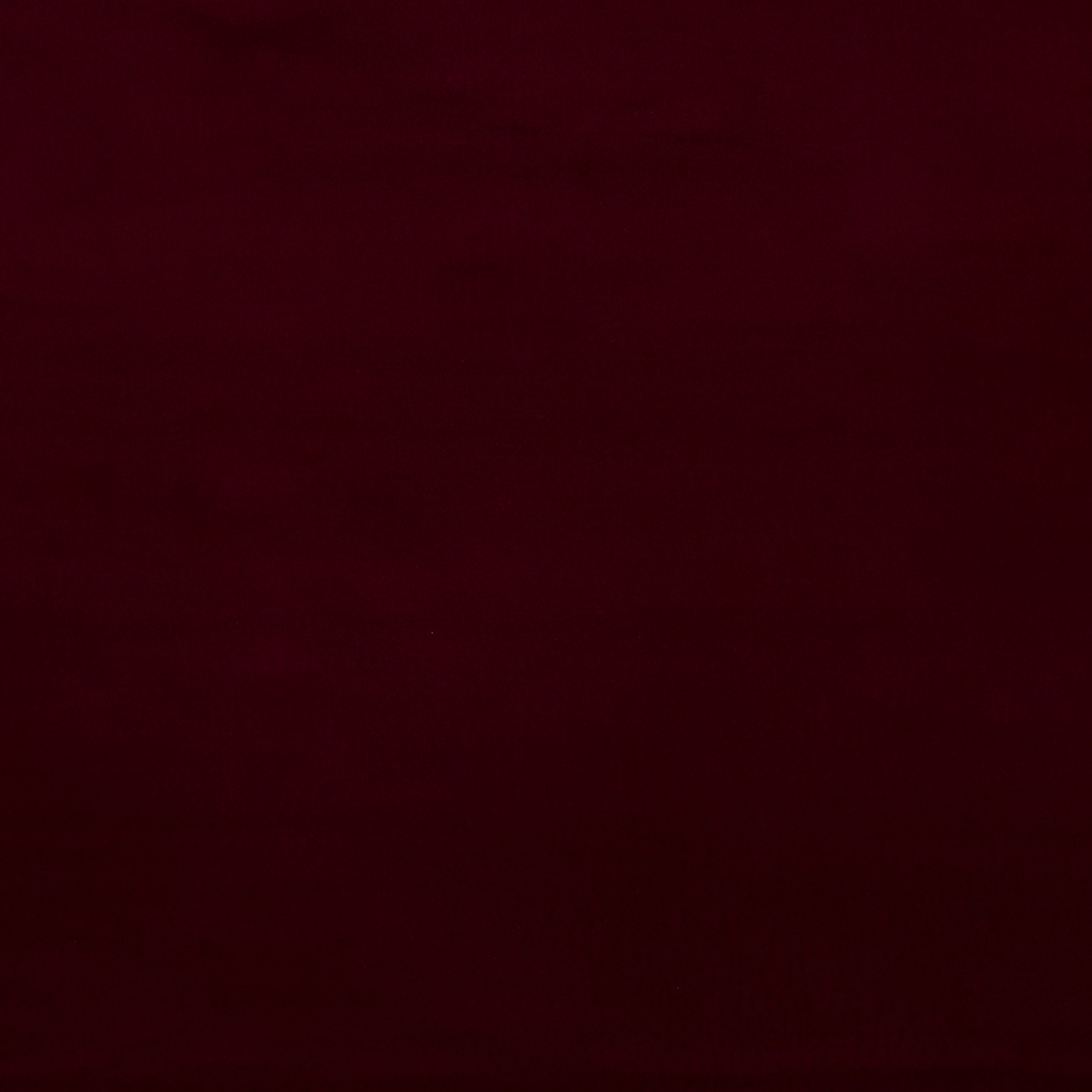 Deep burgundy-red plain cotton swatch with a matte, close-woven surface