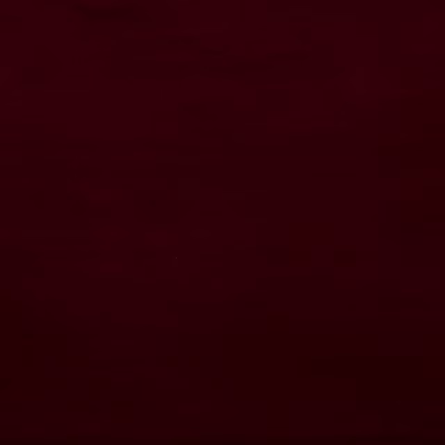 Deep burgundy-red plain cotton swatch with a matte, close-woven surface