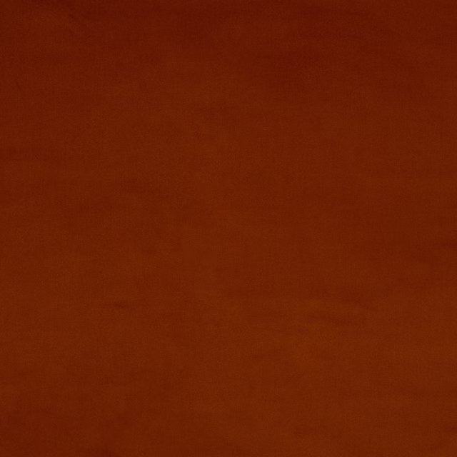 Solid burnt orange cotton swatch with a softly textured plain weave