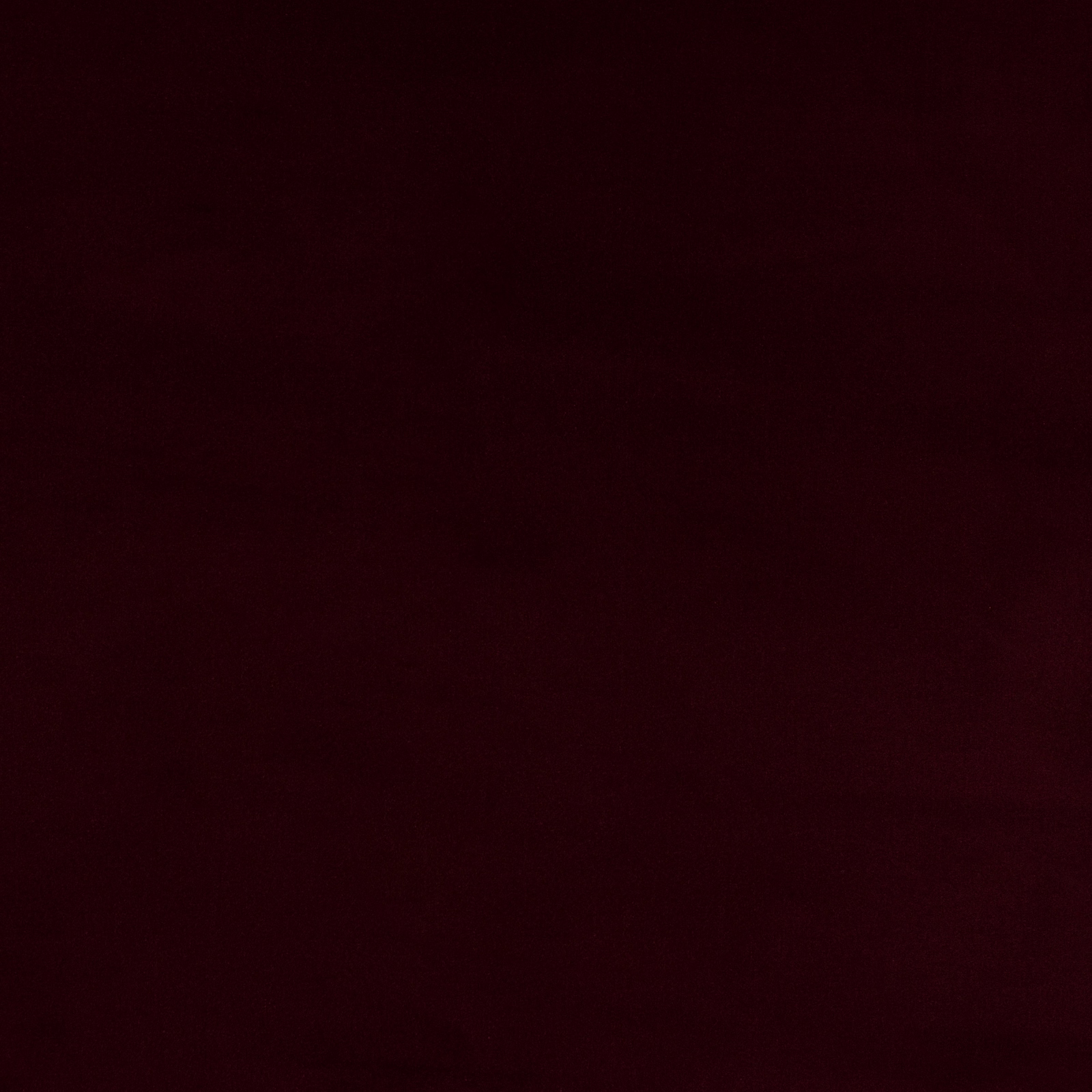 Deep garnet red plain cotton fabric swatch with a smooth, dense surface