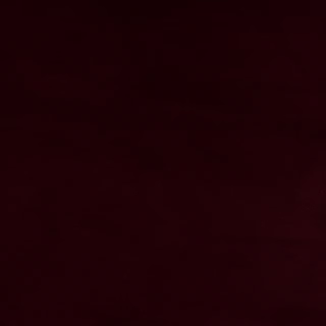 Deep garnet red plain cotton fabric swatch with a smooth, dense surface
