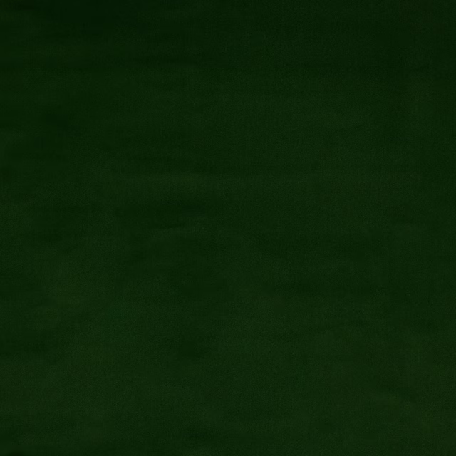 Plain deep forest green cotton fabric with a matte, softly shaded surface