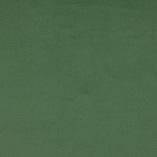 Plain muted sage green cotton fabric with a soft matte texture