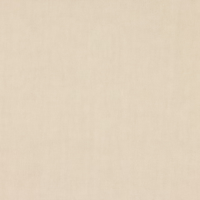 Close-up of soft cream linen plain weave with subtle natural texture