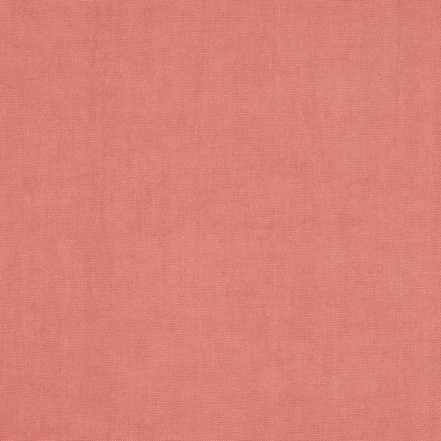 Close-up of a soft dusty rose plain-woven linen fabric