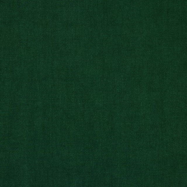 Deep emerald green plain linen fabric with a fine woven texture