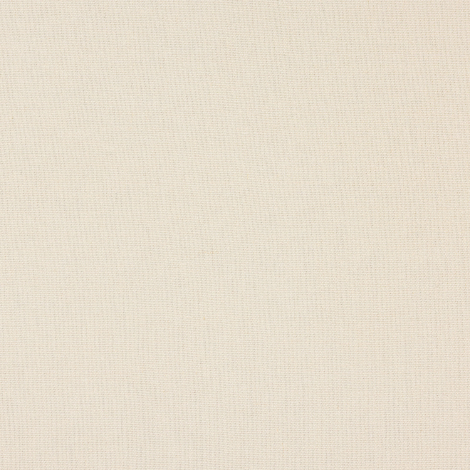 Close-up of soft warm ivory plain linen fabric with fine natural texture