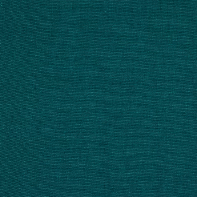 Solid deep teal linen fabric with a fine natural weave