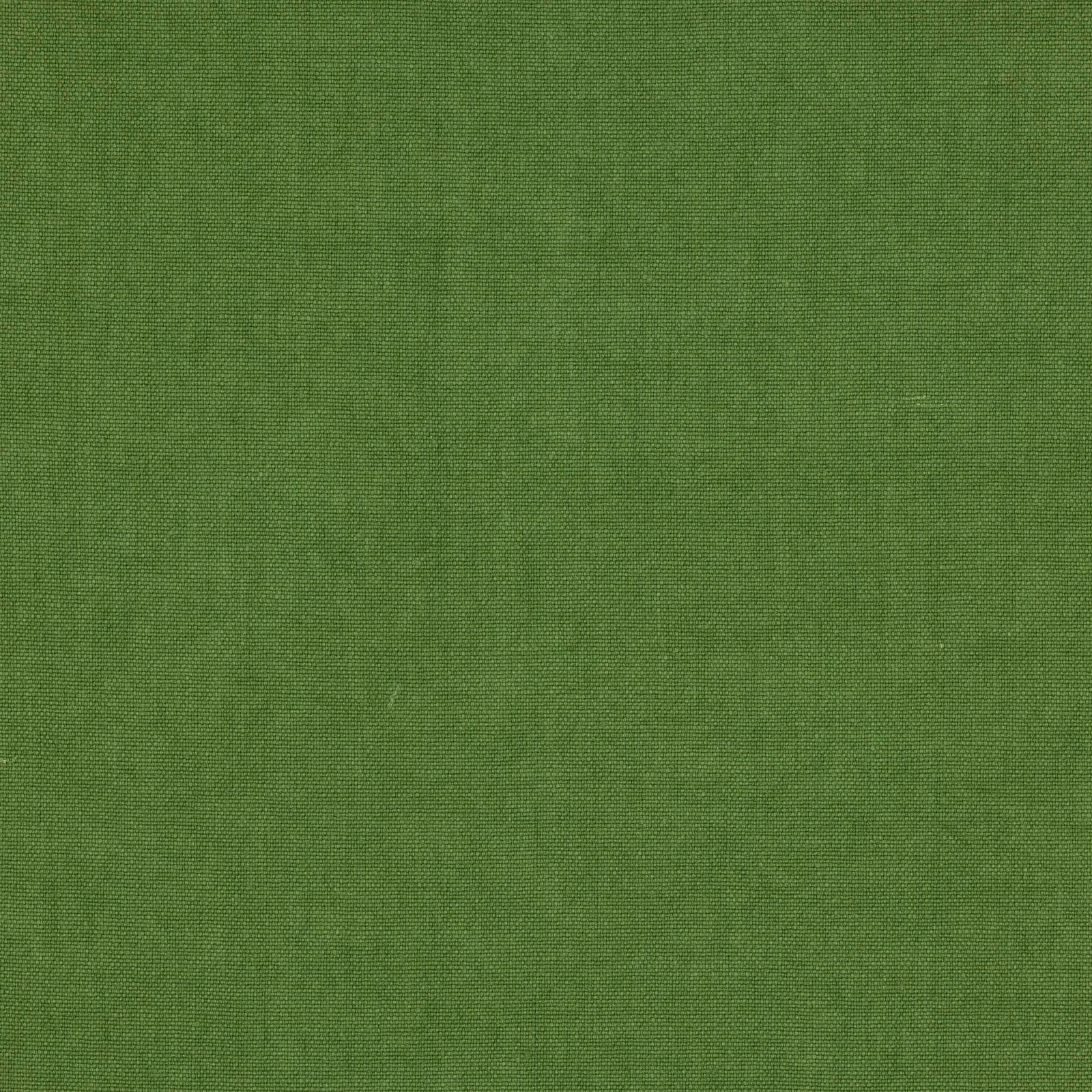 Close-up of fresh moss green plain-woven linen fabric with a fine texture