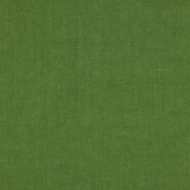 Close-up of fresh moss green plain-woven linen fabric with a fine texture
