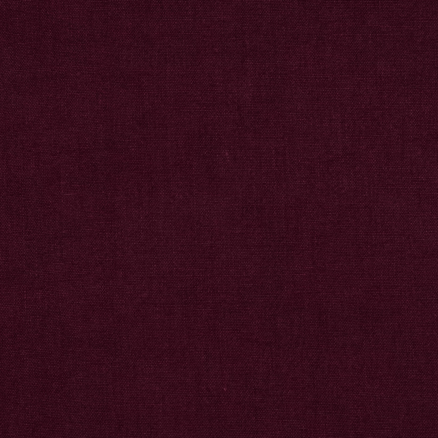 Deep plum linen swatch with a fine plain weave and matte texture